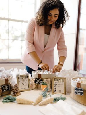 image of a student setting up a table display