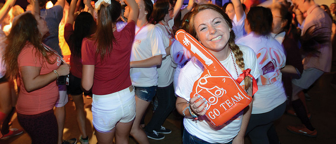 Student with foam finger at Trax