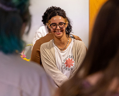 Kyoti Tavarez '24 laughs at the opening of Susquehanna's LGBTQ+ Resource Center.