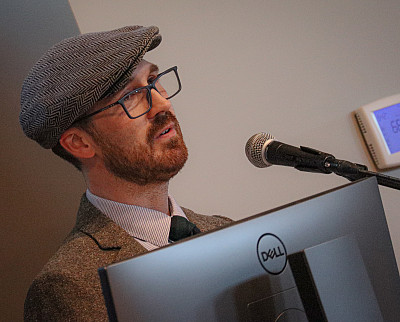 Patrick Thomas Henry '08 speaks at the SU Press launch party.
