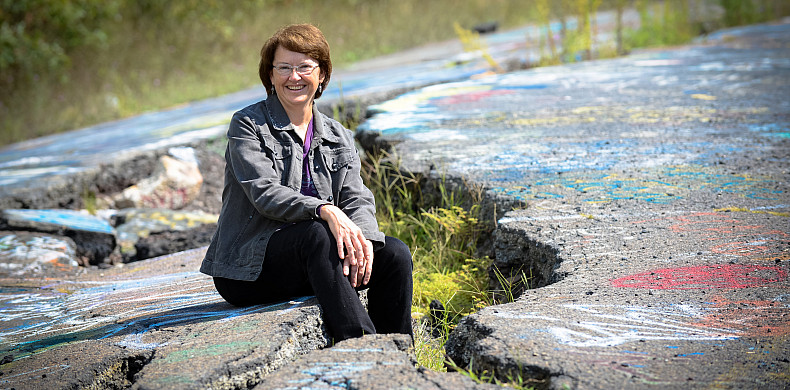Tammy Tobin, chair and professor of biology, on the graffiti highway in Centralia, Pennsylvania.