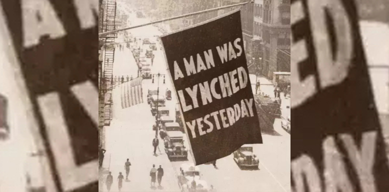 Photograph shows a flag flown from an upper story window of the NAACP headquarters, New York City, announcing a man was lynched yesterday.