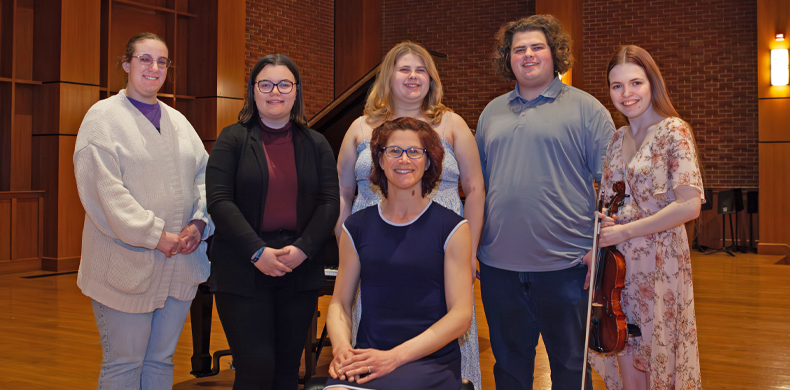 Pictured from left are Julia Drewes '26, Kaeli Waldstein '26, Ainsley Segedy '26, Robert Speece '26 and Julia Dudek '26. Seated is Jaime ...
