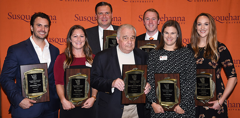 New inductees into Susquehanna's Athletics Hall of Fame are, front row from left, Chris Price '10, Devin Lessard '13, Dr. Michael Cordas ...